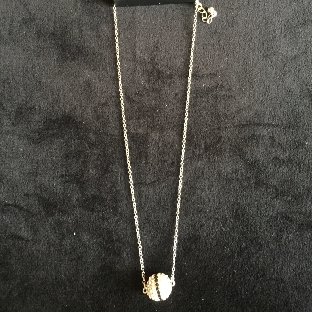 Faux silver and faux clear and black stone ball